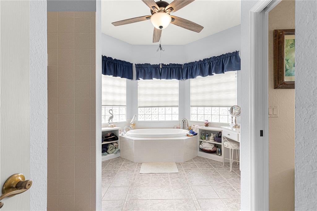11799 Southeast 173rd Ln Road Summerfield, FL 34491 - Photo 37 of 83 a spacious bathroom with a bathtub and a shower
