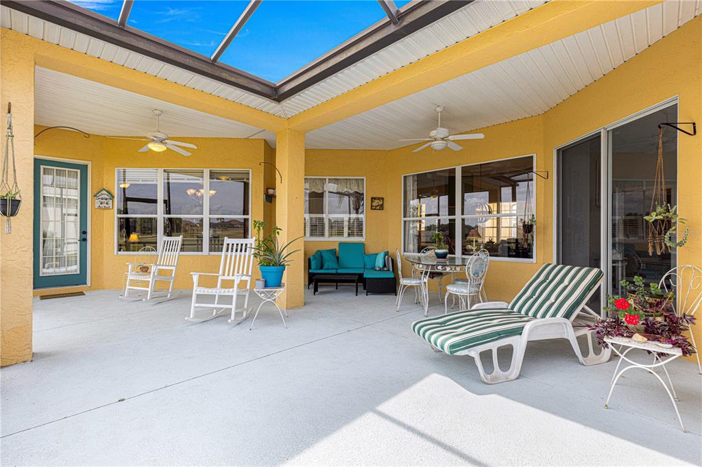 11799 Southeast 173rd Ln Road Summerfield, FL 34491 - Photo 44 of 83 a view of living room with patio furniture and floor to ceiling window