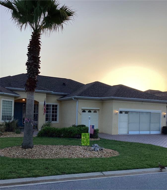 11799 Southeast 173rd Ln Road Summerfield, FL 34491 - Photo 49 of 83 a front view of a house with a garden