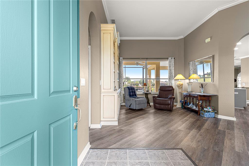 11799 Southeast 173rd Ln Road Summerfield, FL 34491 - Photo 5 of 83 a living room with furniture and a wooden floor