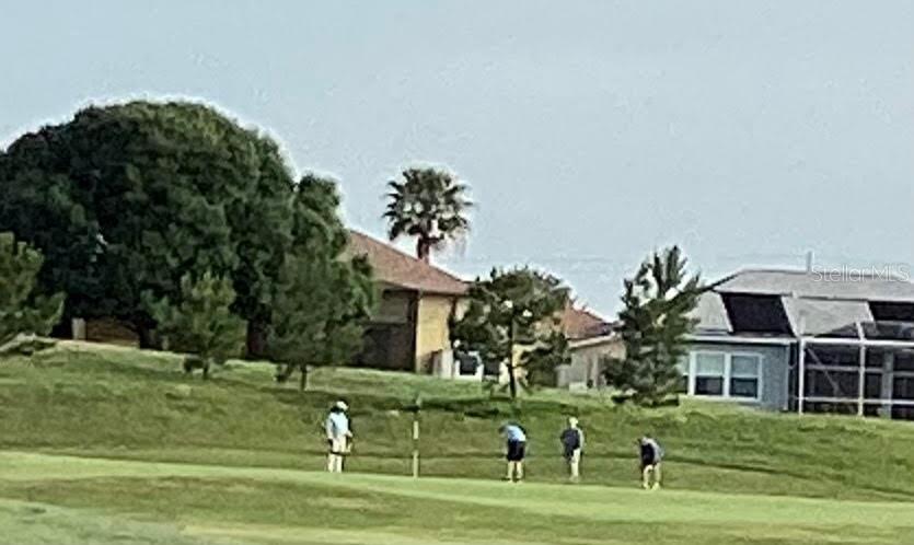 11799 Southeast 173rd Ln Road Summerfield, FL 34491 - Photo 78 of 83 a front view of a house with a garden
