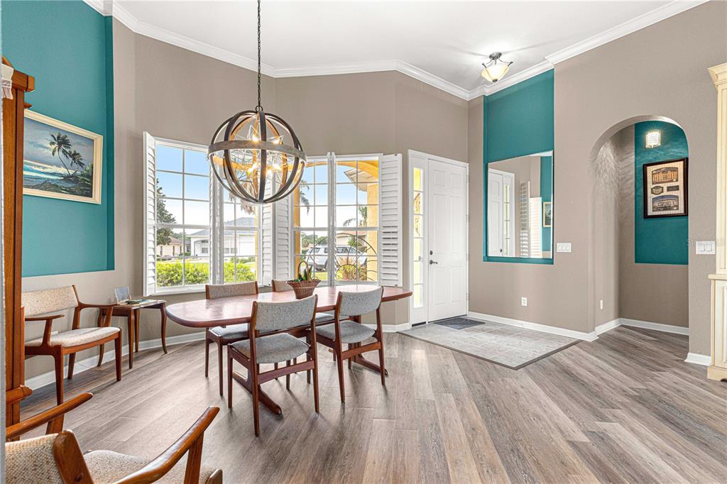 11799 Southeast 173rd Ln Road Summerfield, FL 34491 - Photo 8 of 83 a view of a dining room with furniture window and wooden floor