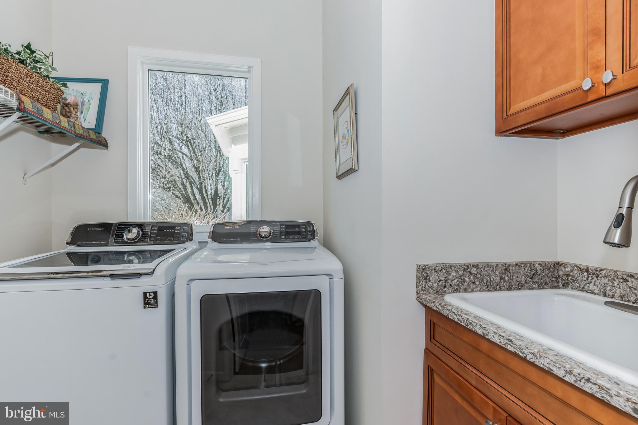 20892 Waterbeach Place Sterling, VA 20165 - Photo 22 of 40 laundry room with cabinets