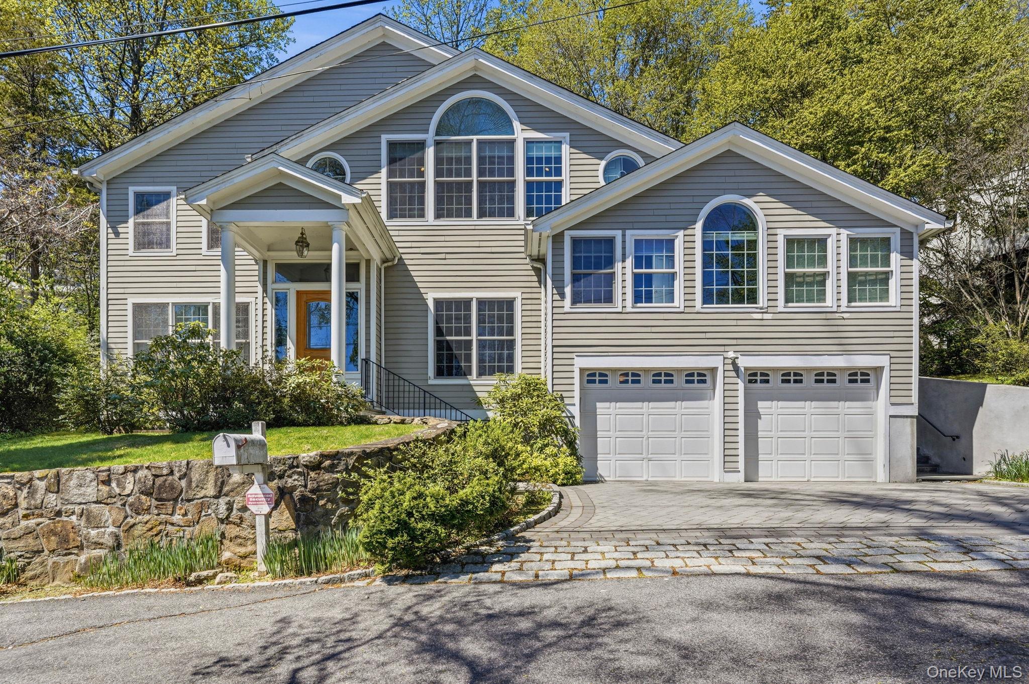 60 Hillside Lane New Rochelle, NY 10804 - Photo 1 of 44 a front view of a house with a yard