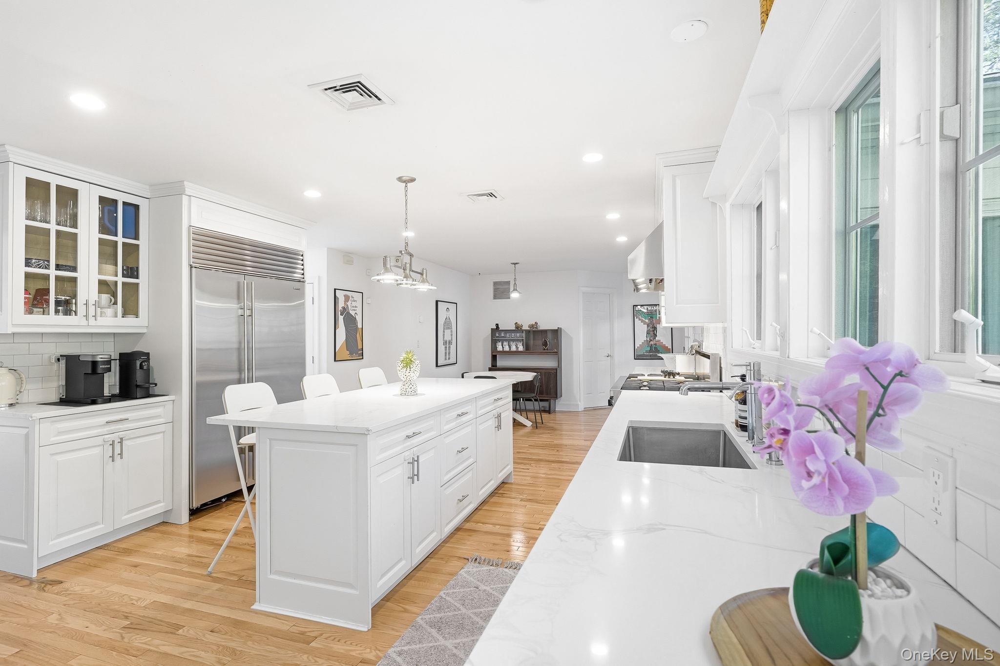 60 Hillside Lane New Rochelle, NY 10804 - Photo 13 of 44 a large white room with a large window and furniture