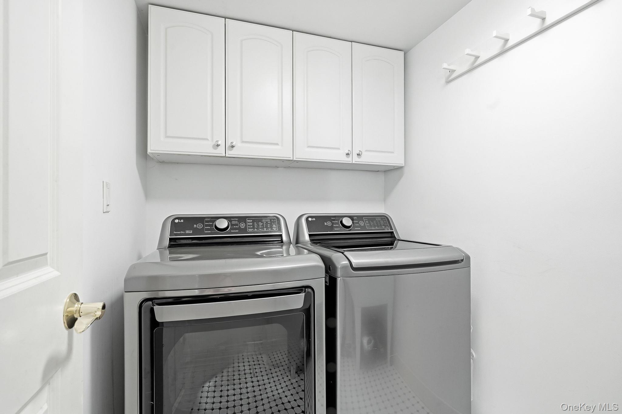 60 Hillside Lane New Rochelle, NY 10804 - Photo 15 of 44 a view of a storage and utility room with washer and dryer