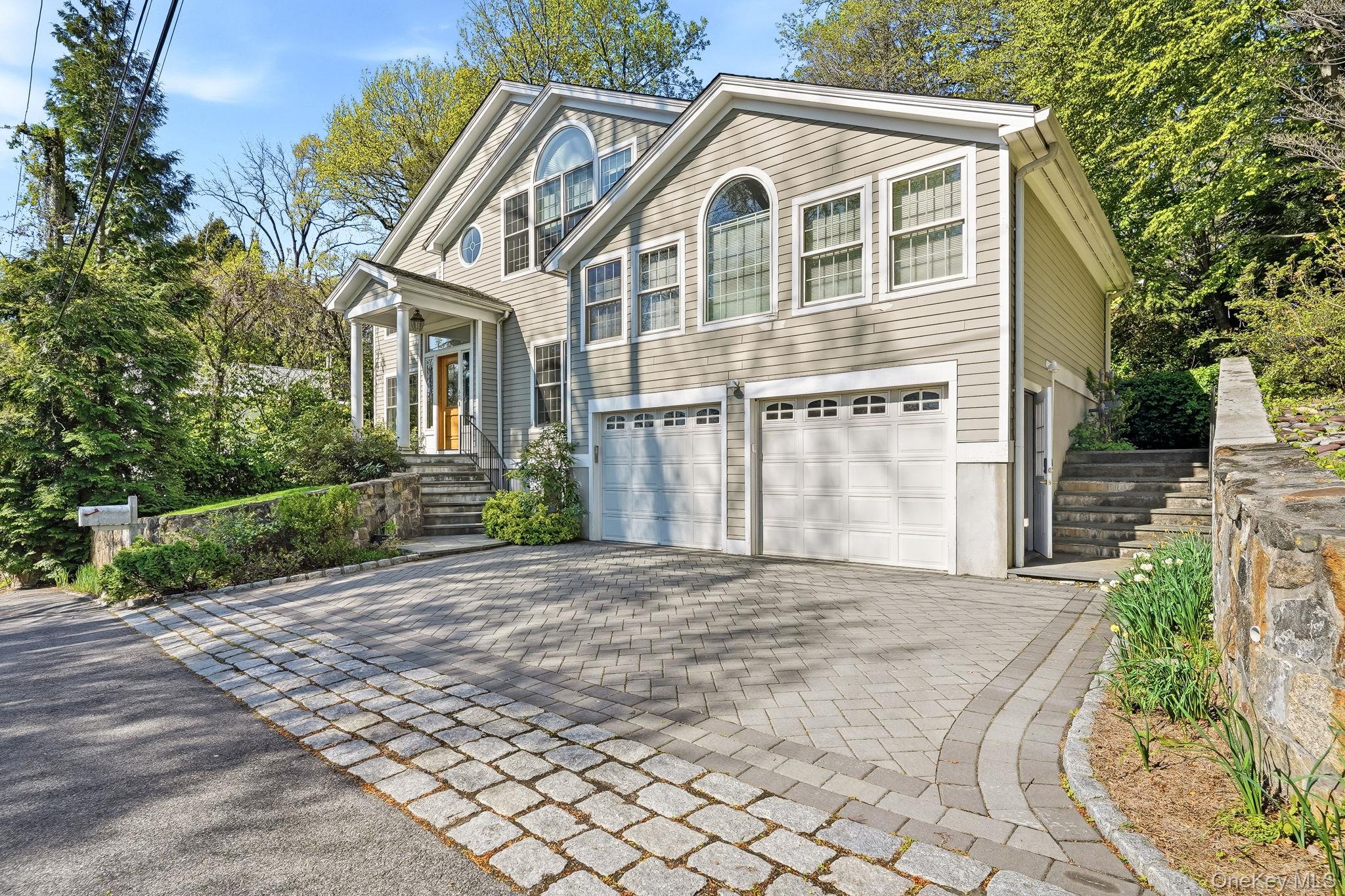 60 Hillside Lane New Rochelle, NY 10804 - Photo 2 of 44 a front view of a house with a garden