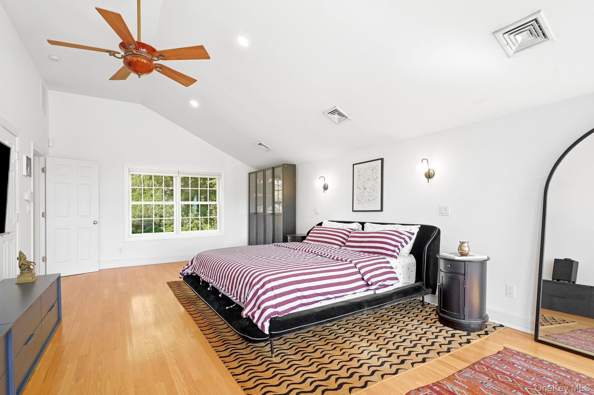 60 Hillside Lane New Rochelle, NY 10804 - Photo 24 of 44 a bedroom with a bed and a flat screen tv