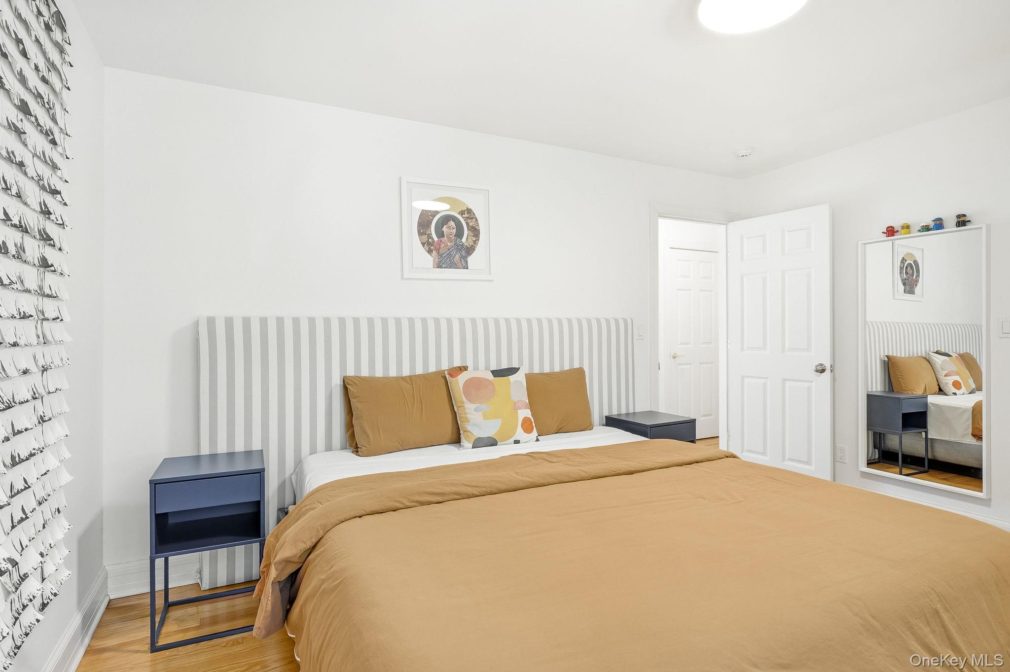 60 Hillside Lane New Rochelle, NY 10804 - Photo 29 of 44 a bedroom with a bed and a chair