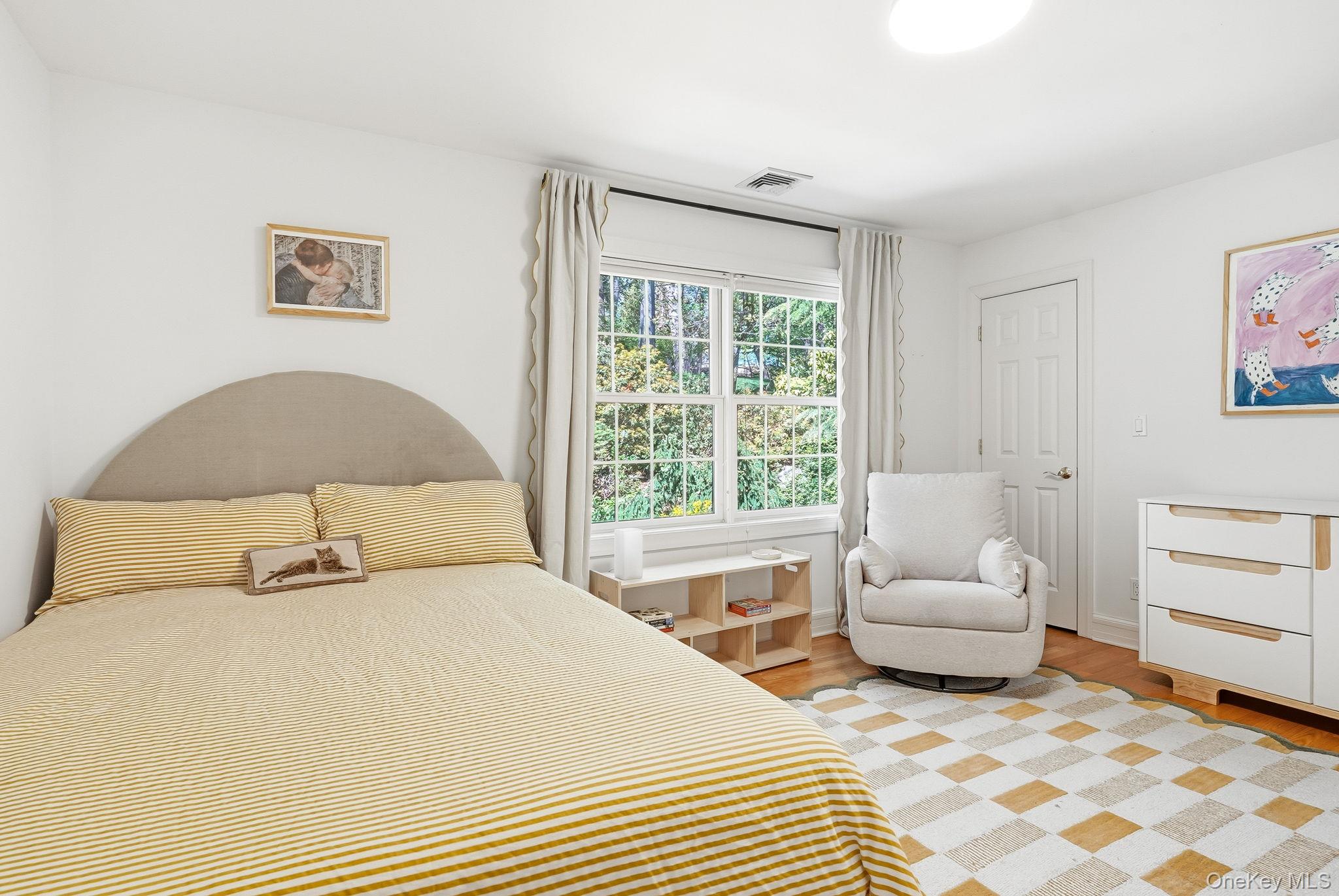 60 Hillside Lane New Rochelle, NY 10804 - Photo 32 of 44 a bedroom with a bed and a couch