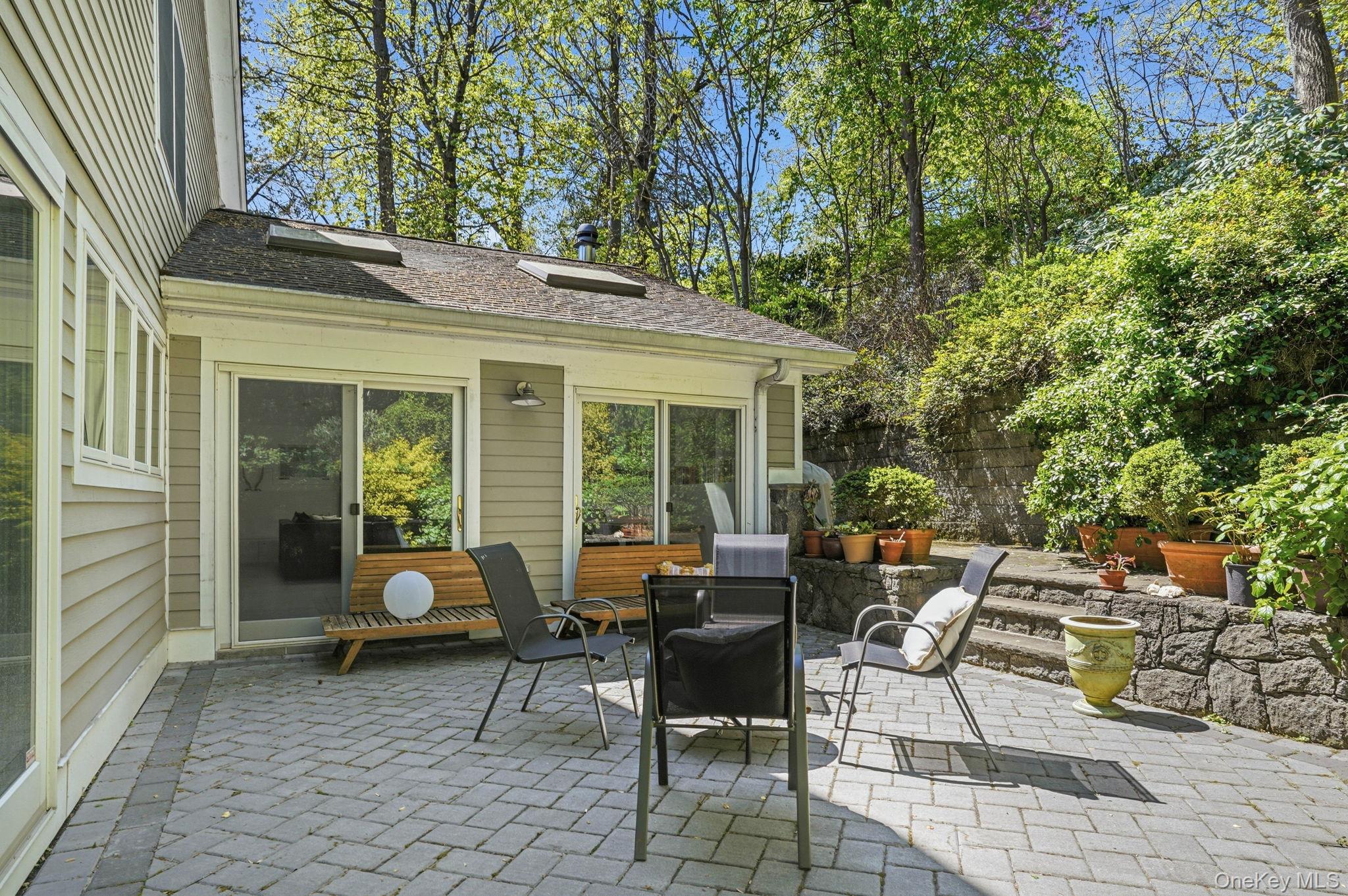 60 Hillside Lane New Rochelle, NY 10804 - Photo 37 of 44 a view of a house with backyard sitting area and garden