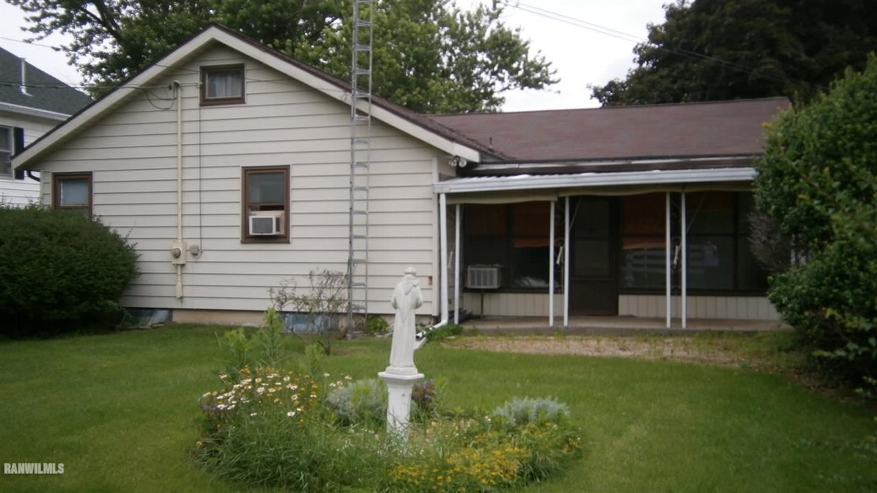 314 South Ridge Street Shannon, IL 61078 - Photo 13 of 15 a view of a house with a yard and plants