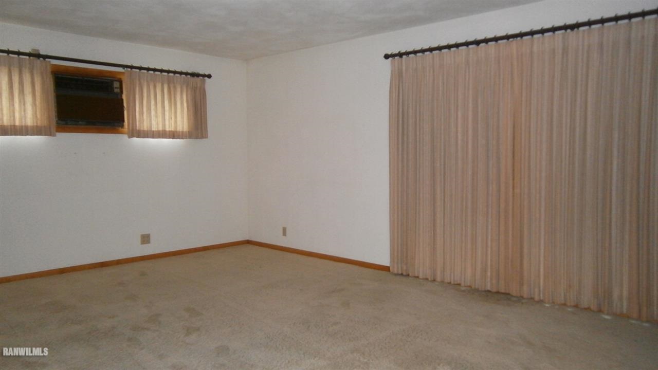 314 South Ridge Street Shannon, IL 61078 - Photo 4 of 15 an empty room with a empty space and a window