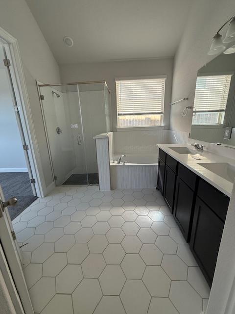 1432 Ridge Runner Drive Georgetown, TX 78628 - Photo 15 of 27 Full bathroom with double vanity, a garden tub, a low entry shower stall, and light tile patterned floors