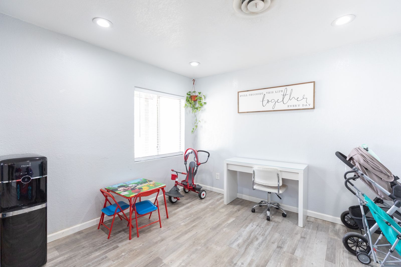 234 Panamint Avenue Ridgecrest, CA 93555 - Photo 12 of 25 a view of a workspace with furniture and a window