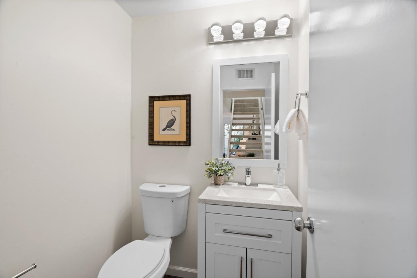 1032 Strayer Drive San Jose, CA 95129 - Photo 18 of 31 a bathroom with a toilet sink and mirror