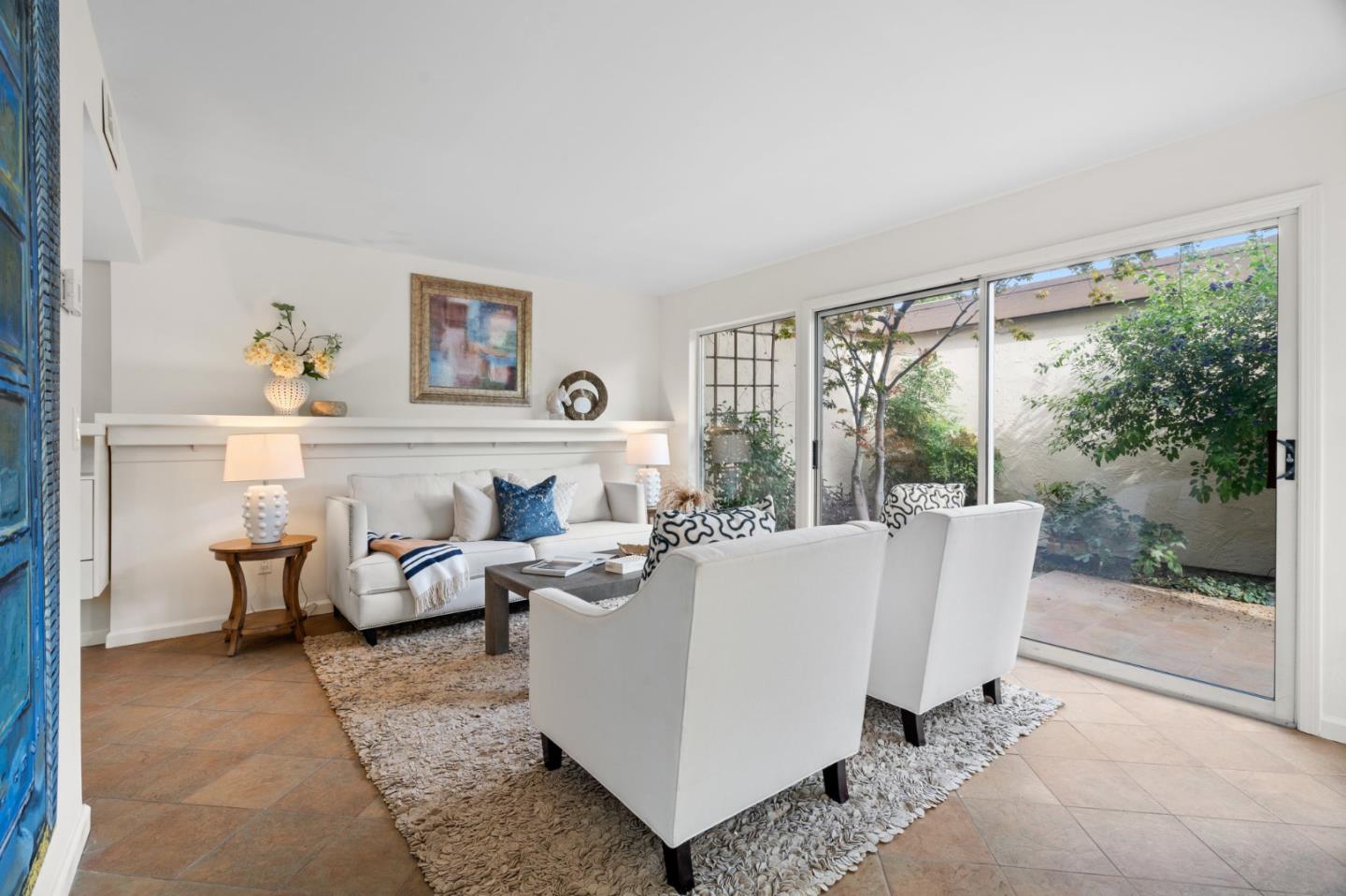 1032 Strayer Drive San Jose, CA 95129 - Photo 5 of 31 a living room with furniture a large window and a table
