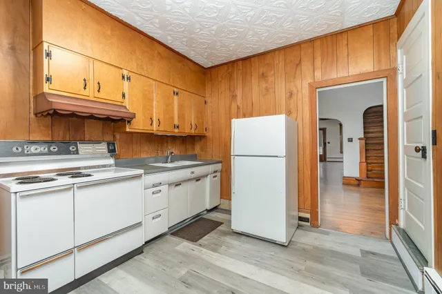 a view of a kitchen with storage and utility