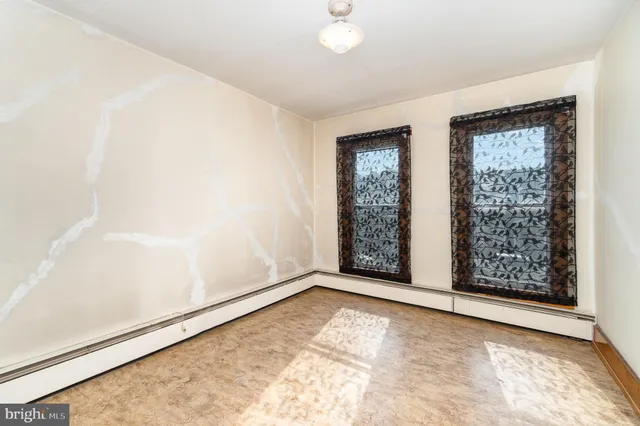 an empty room with windows