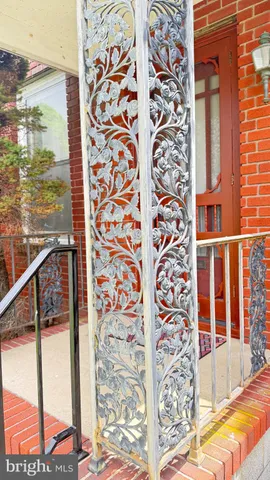 a view of a balcony with floor to ceiling windows