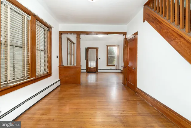 a view of a hallway with the glass door