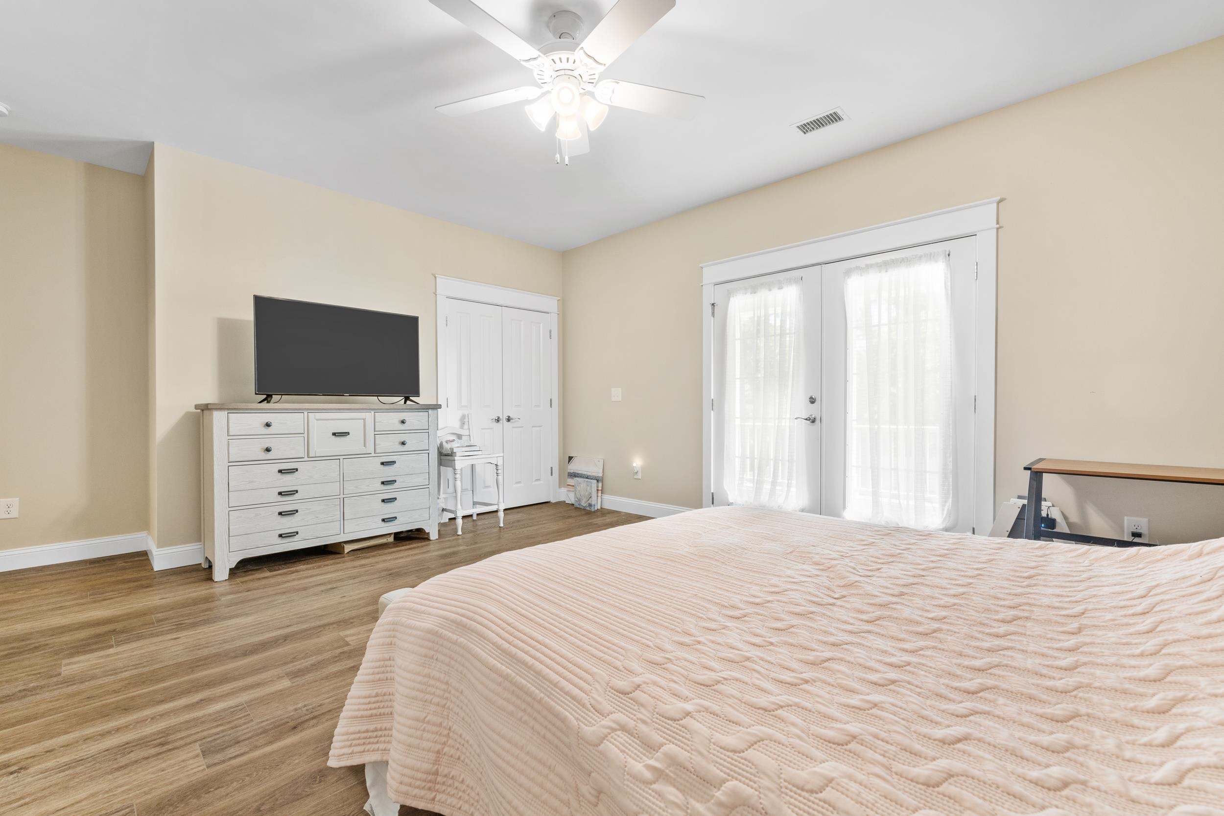 5907 Haskell Circle Myrtle Beach, SC 29577 - Photo 17 of 38 Bedroom with access to exterior, ceiling fan, french doors, light wood-type flooring, and a closet
