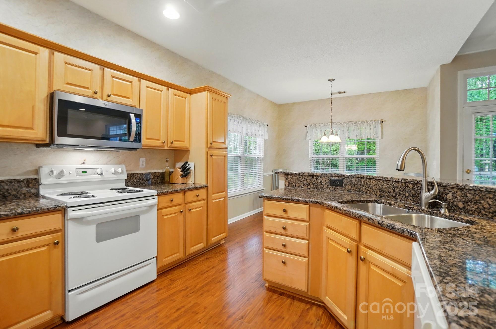 13505 Michael Lynn Road Charlotte, NC 28278 - Photo 11 of 24 a kitchen with granite countertop a sink stainless steel appliances and cabinets