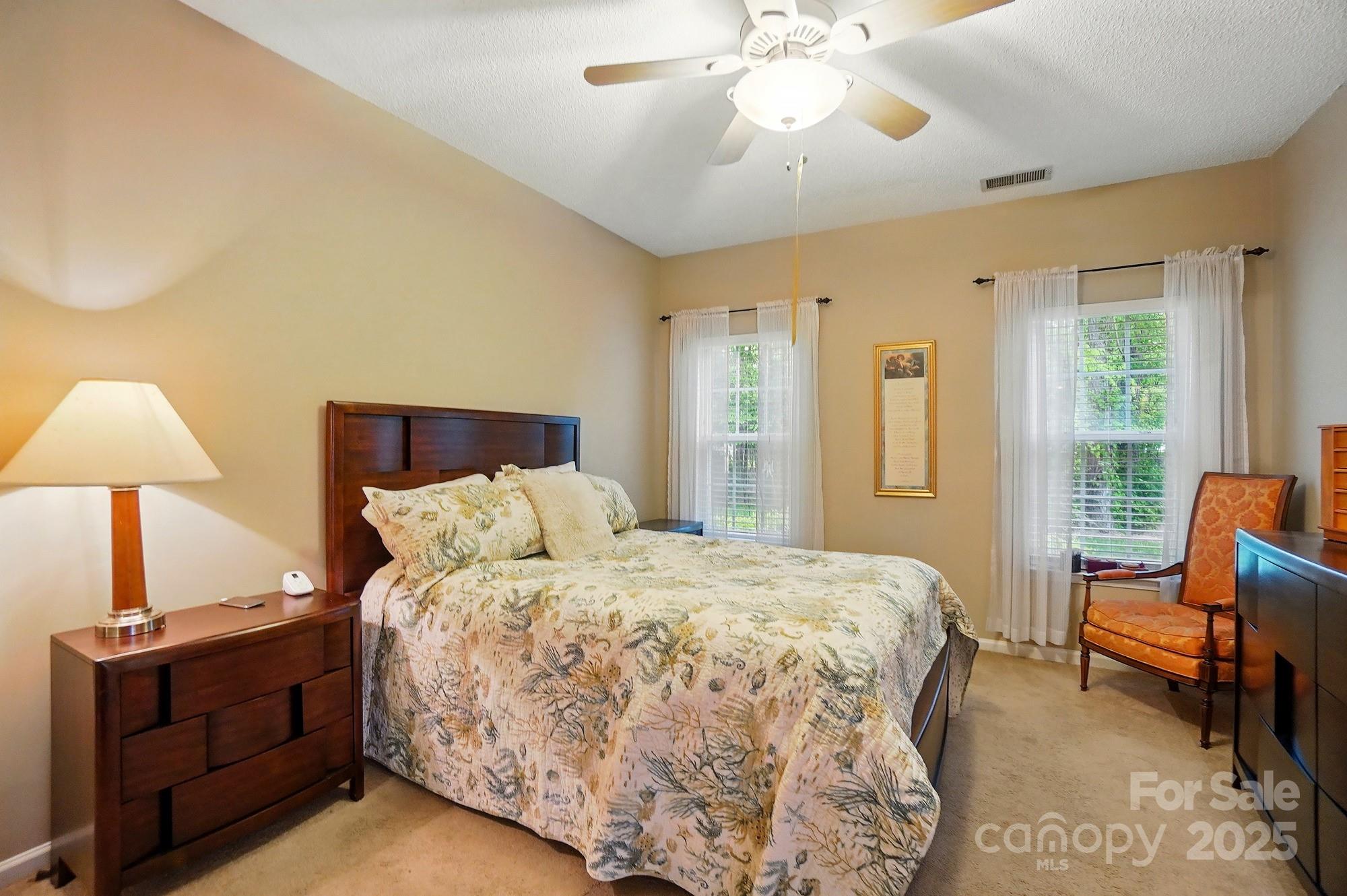 13505 Michael Lynn Road Charlotte, NC 28278 - Photo 13 of 24 a bedroom with a bed and wooden floor