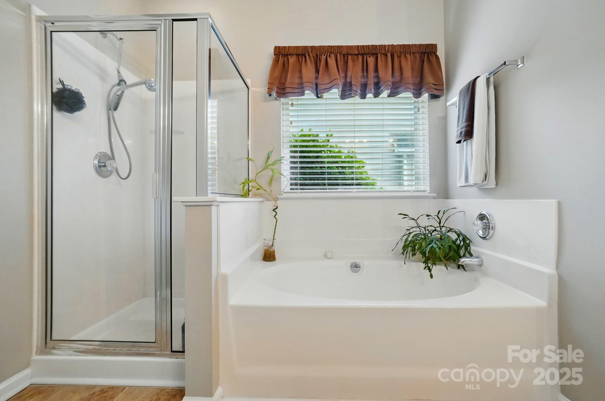 13505 Michael Lynn Road Charlotte, NC 28278 - Photo 16 of 24 a bathroom with a bathtub and a shower