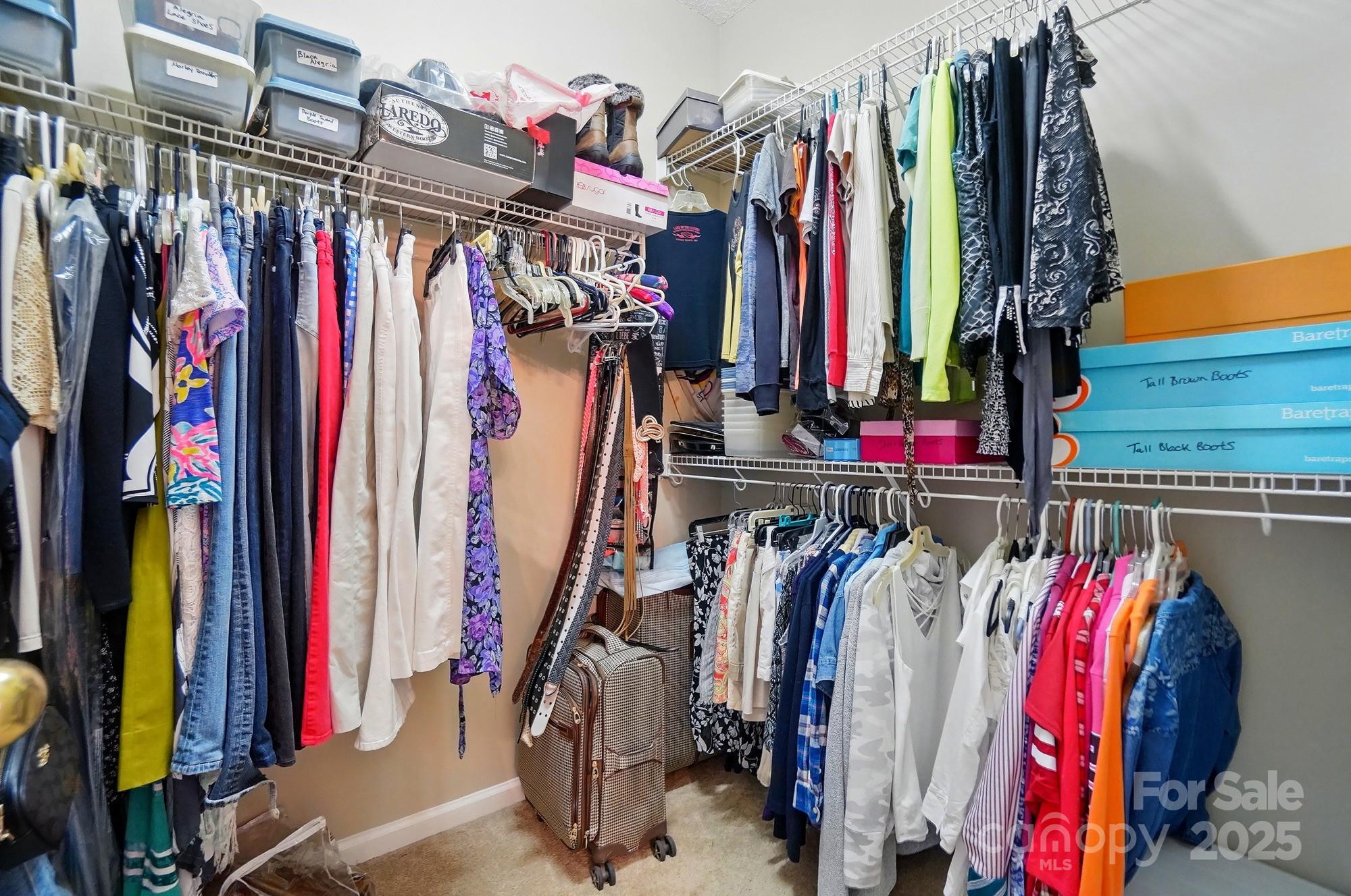 13505 Michael Lynn Road Charlotte, NC 28278 - Photo 17 of 24 a view of walk in closet with clothes