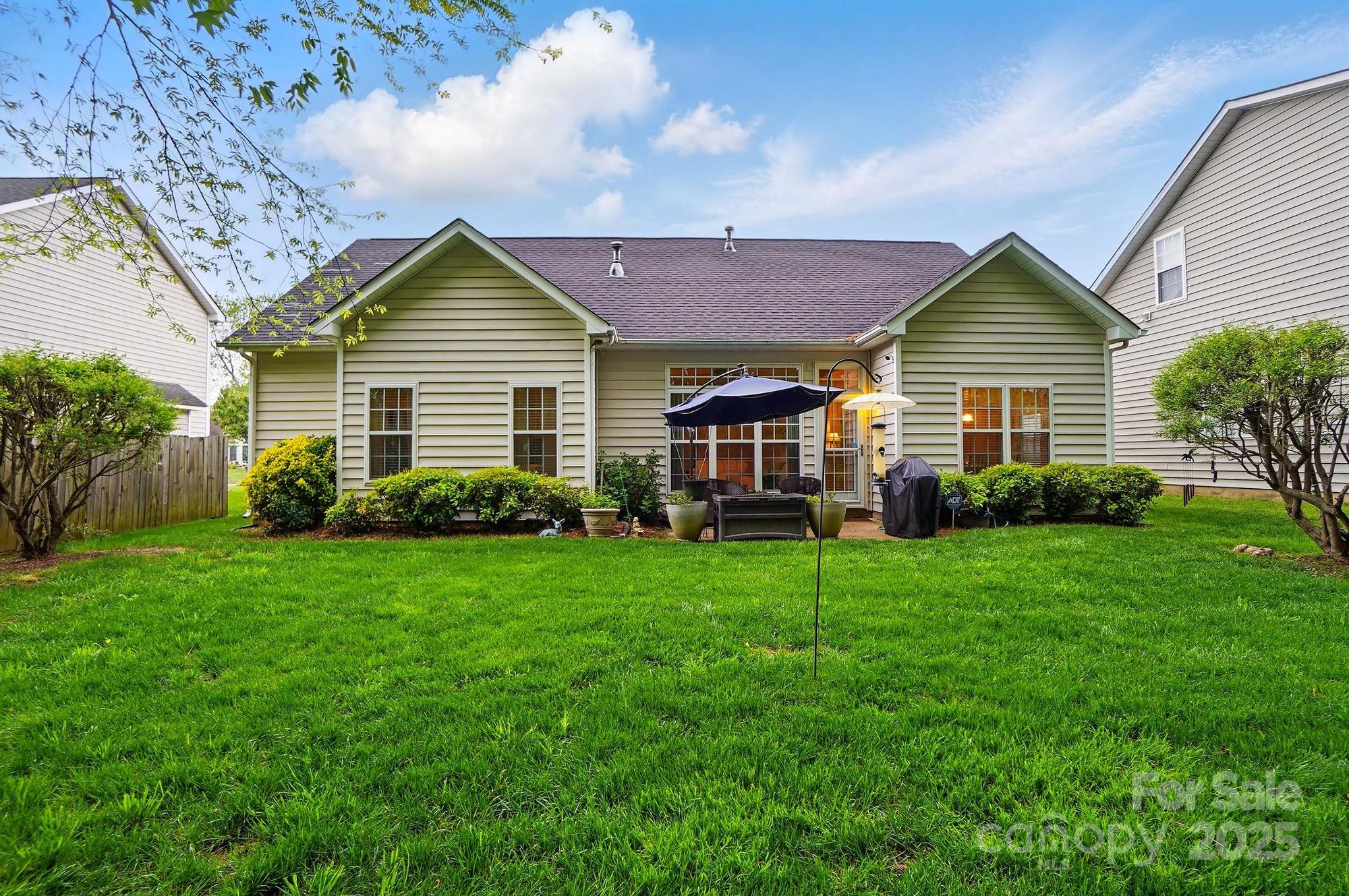 13505 Michael Lynn Road Charlotte, NC 28278 - Photo 22 of 24 a view of a house with backyard and garden