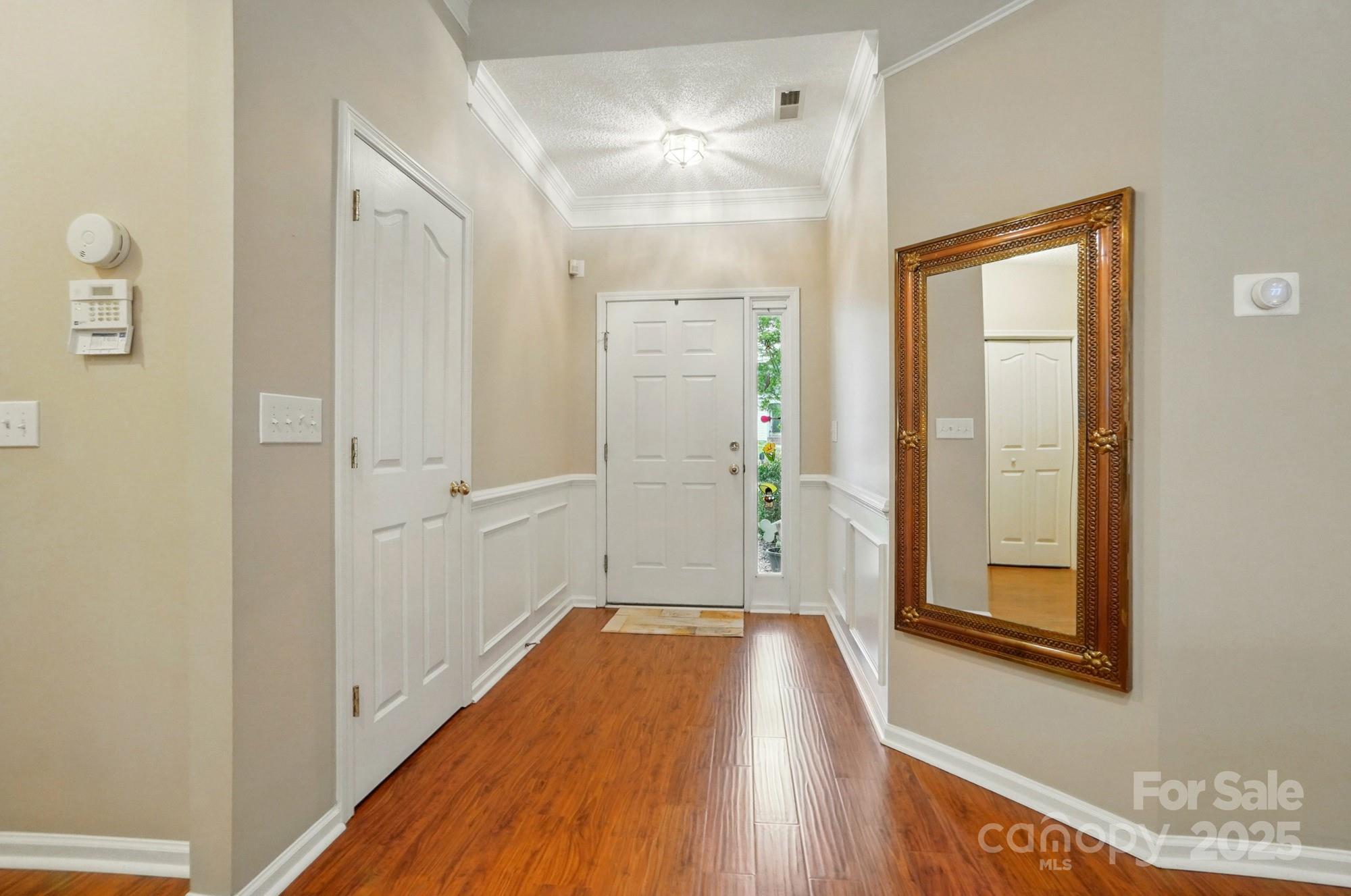 13505 Michael Lynn Road Charlotte, NC 28278 - Photo 3 of 24 a view of a hallway with wooden floor and a bathroom