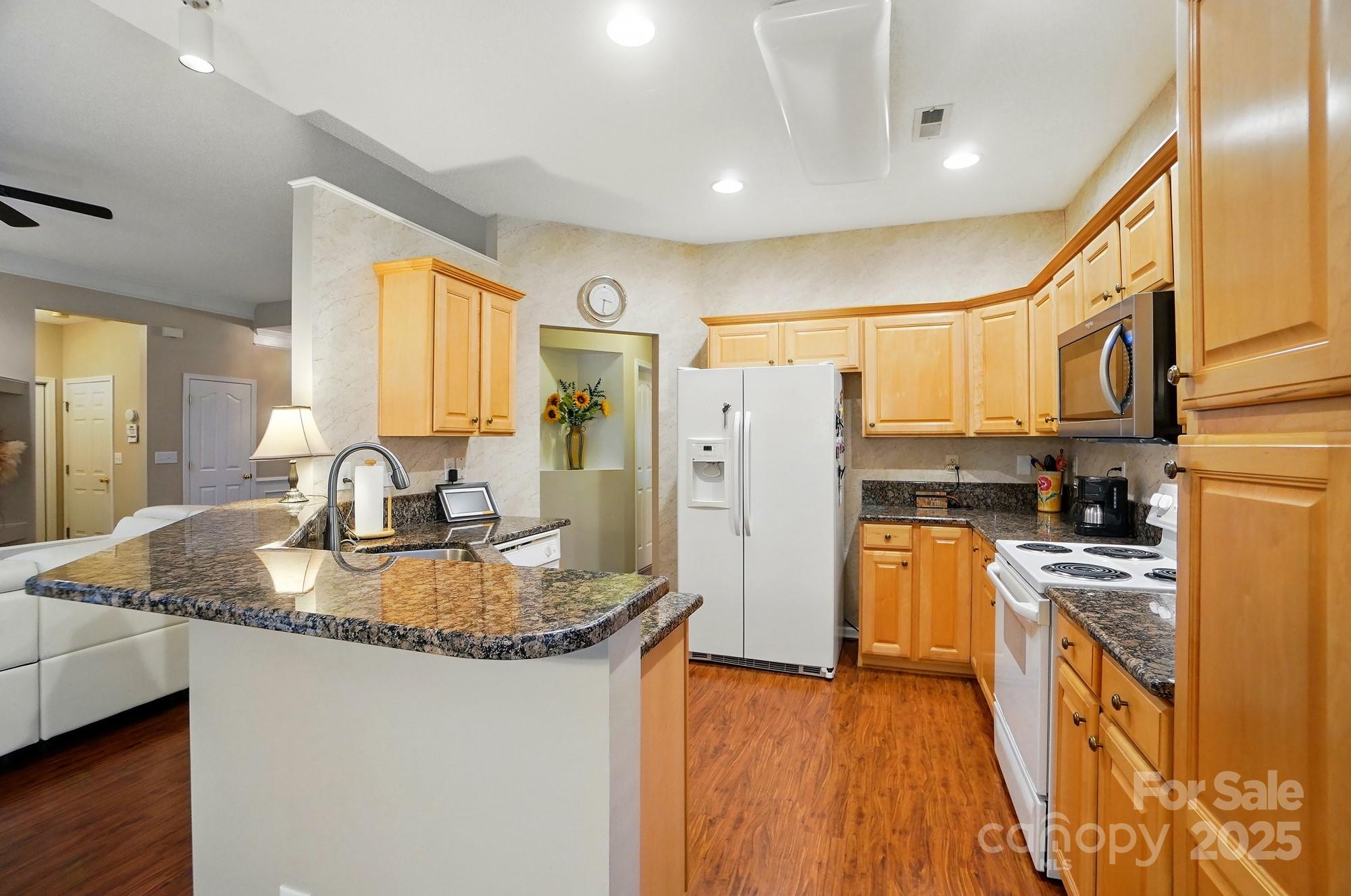 13505 Michael Lynn Road Charlotte, NC 28278 - Photo 9 of 24 a kitchen with stainless steel appliances granite countertop a refrigerator a stove and a sink