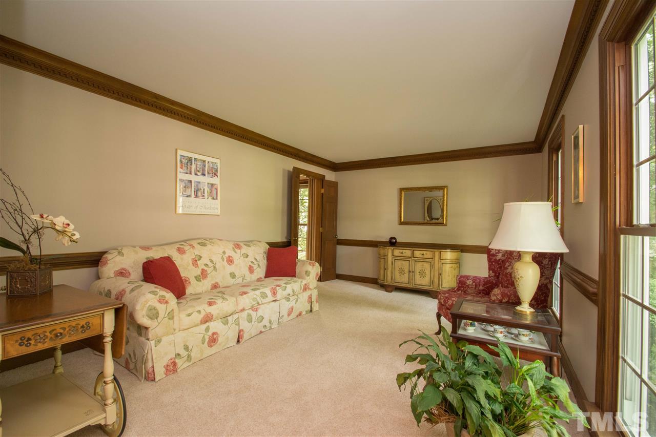 8000 Running Cedar Trail Raleigh, NC 27615 - Photo 2 of 18 a living room with furniture flowerpot and a lamp