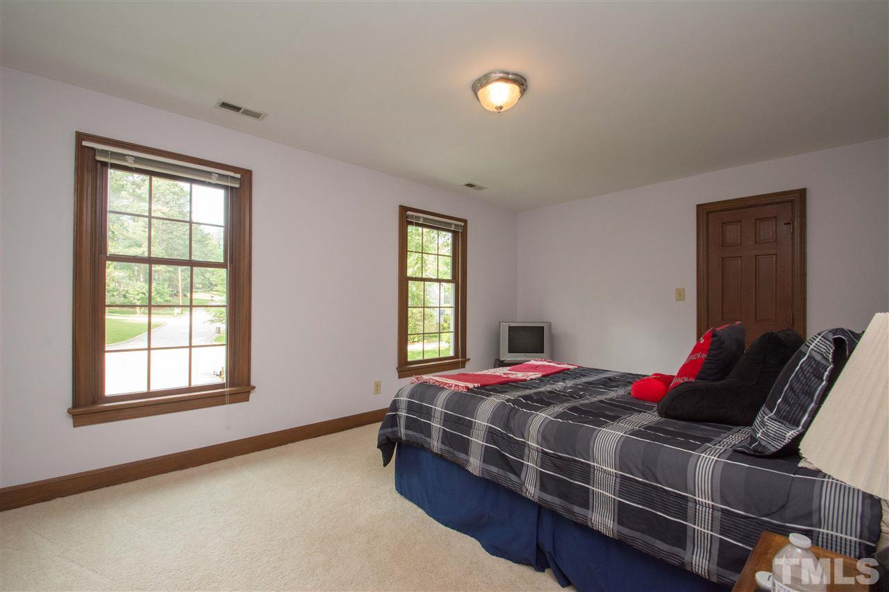 8000 Running Cedar Trail Raleigh, NC 27615 - Photo 11 of 18 a bedroom with a bed and window