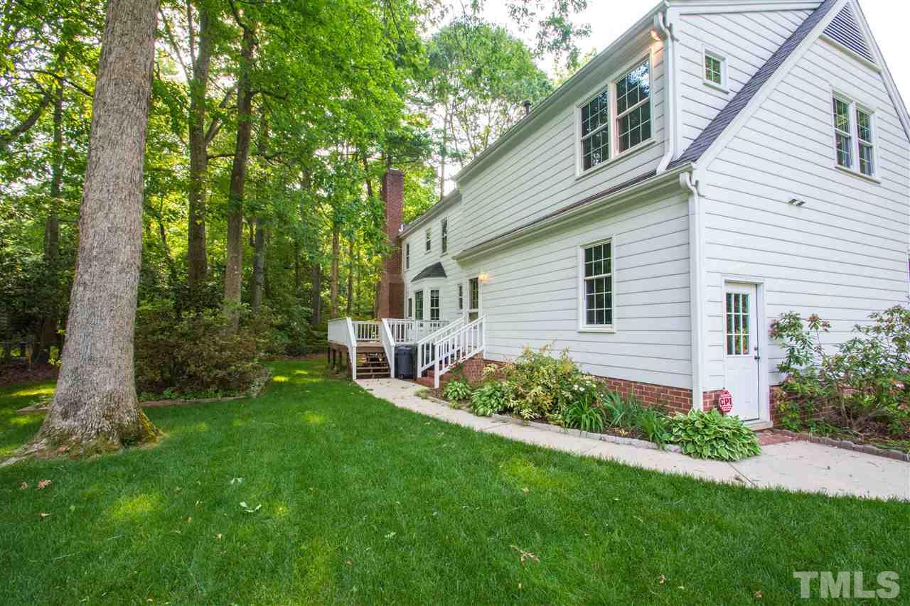 8000 Running Cedar Trail Raleigh, NC 27615 - Photo 16 of 18 a view of a house with a backyard