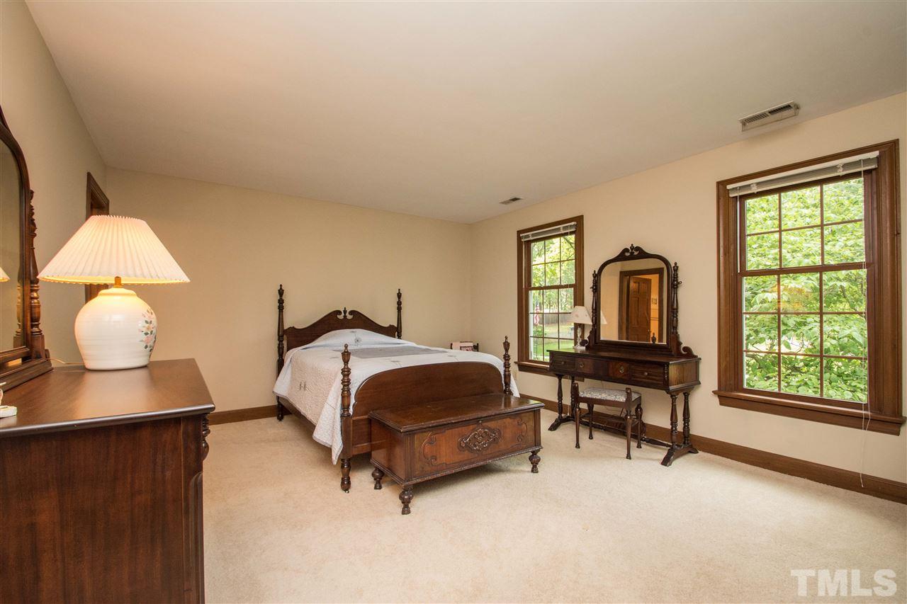8000 Running Cedar Trail Raleigh, NC 27615 - Photo 9 of 18 a bedroom with a bed and a window