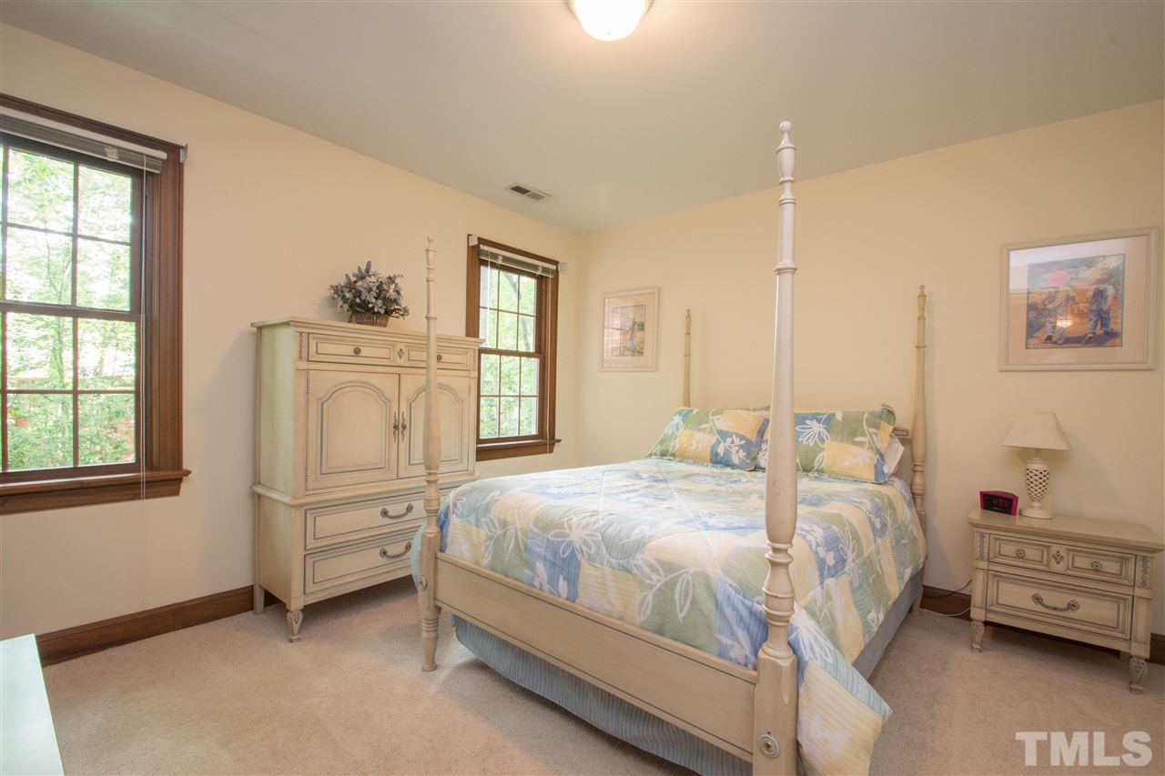 8000 Running Cedar Trail Raleigh, NC 27615 - Photo 10 of 18 a bedroom with a bed and a window