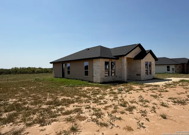 a house with yard in front of it