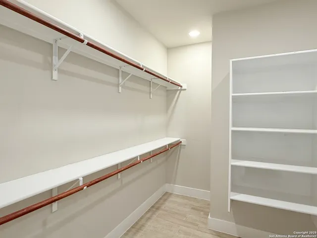 a view of an empty walk in closet