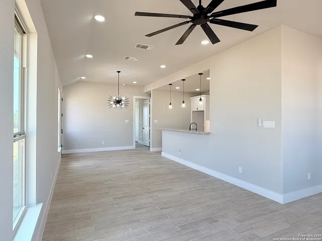 a view of an empty room and window