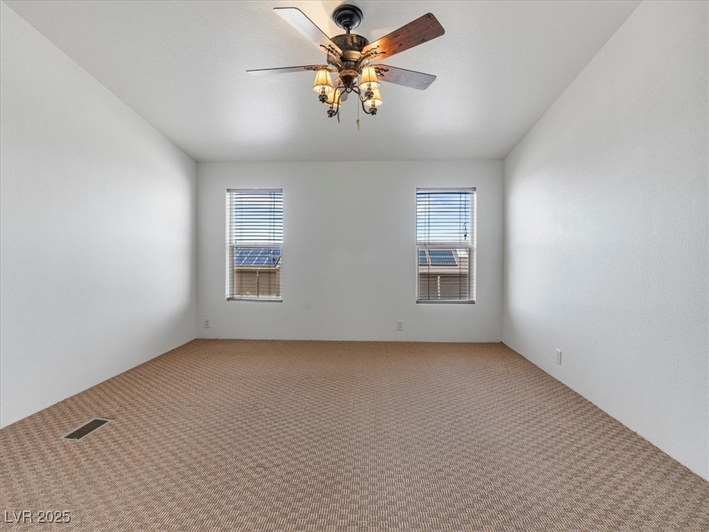 70 West Bonanza Road Las Vegas, NV 89124 - Photo 26 of 71 Carpeted empty room featuring ceiling fan