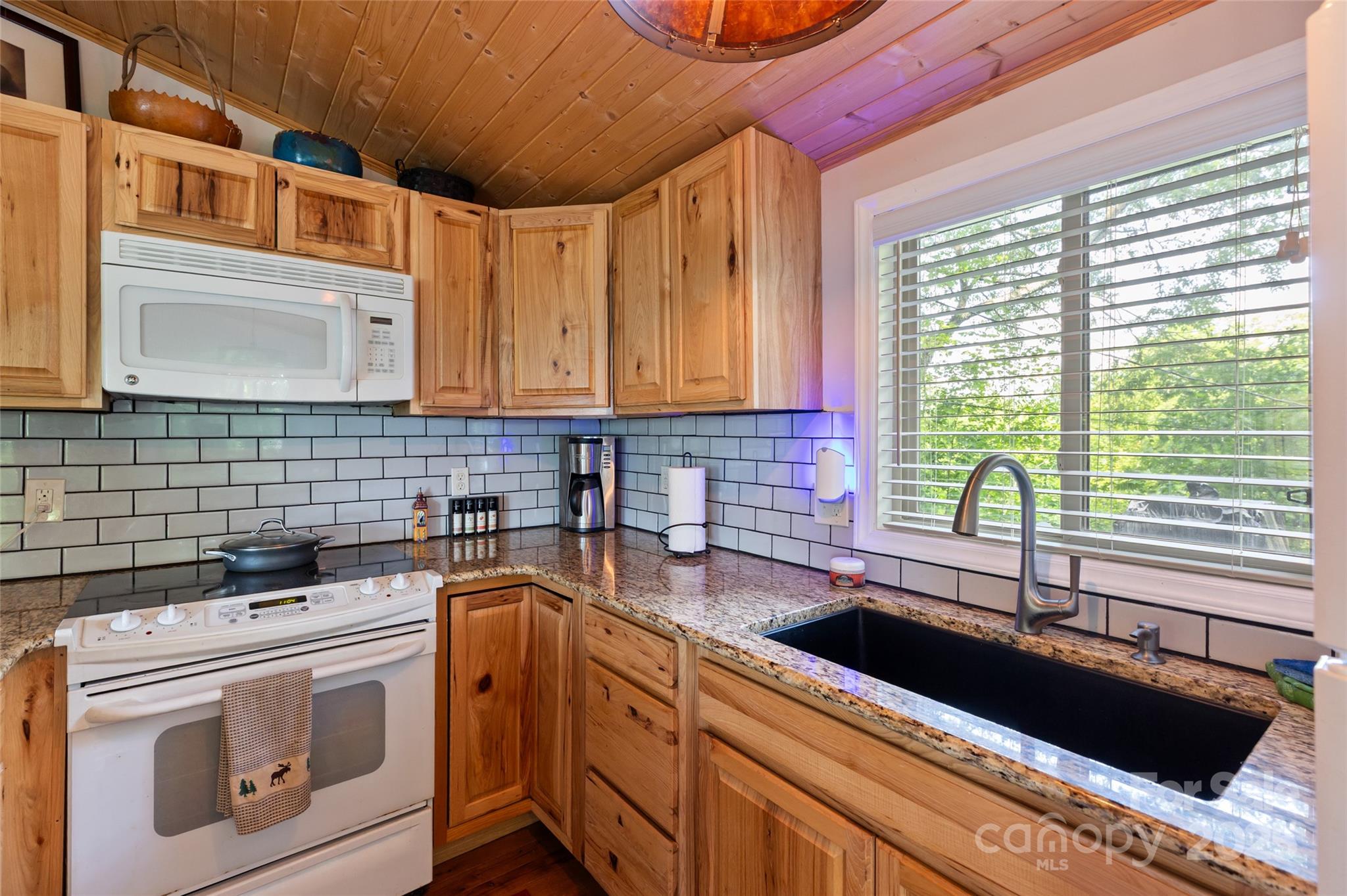 56 Faraway Drive Cullowhee, NC 28723 - Photo 20 of 46 a kitchen that has a sink and a stove