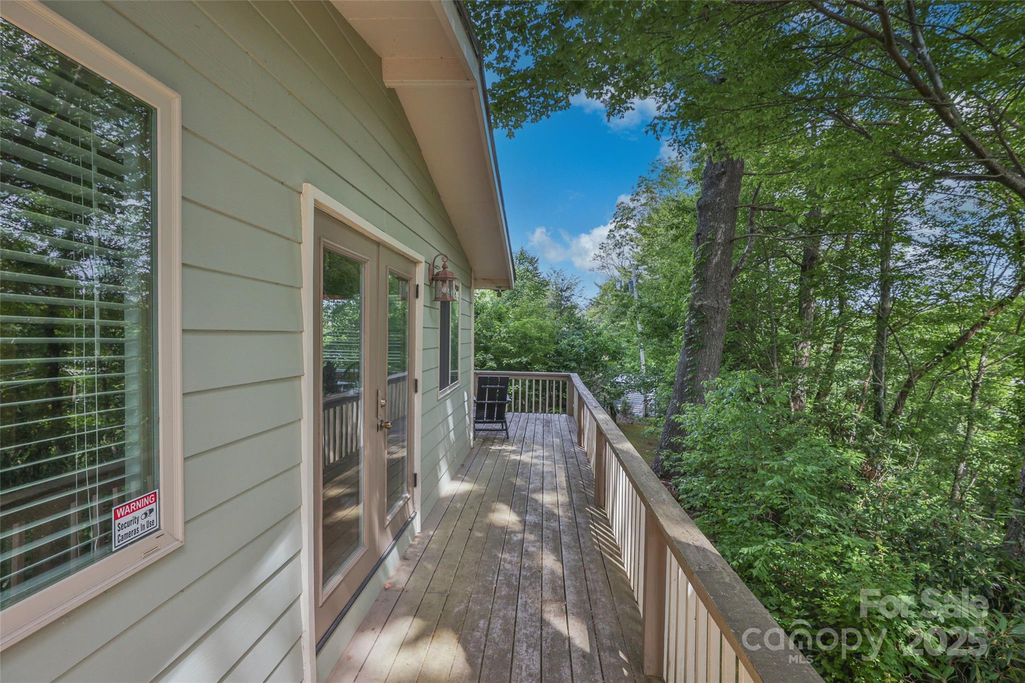 56 Faraway Drive Cullowhee, NC 28723 - Photo 22 of 46 a balcony with trees in front of it