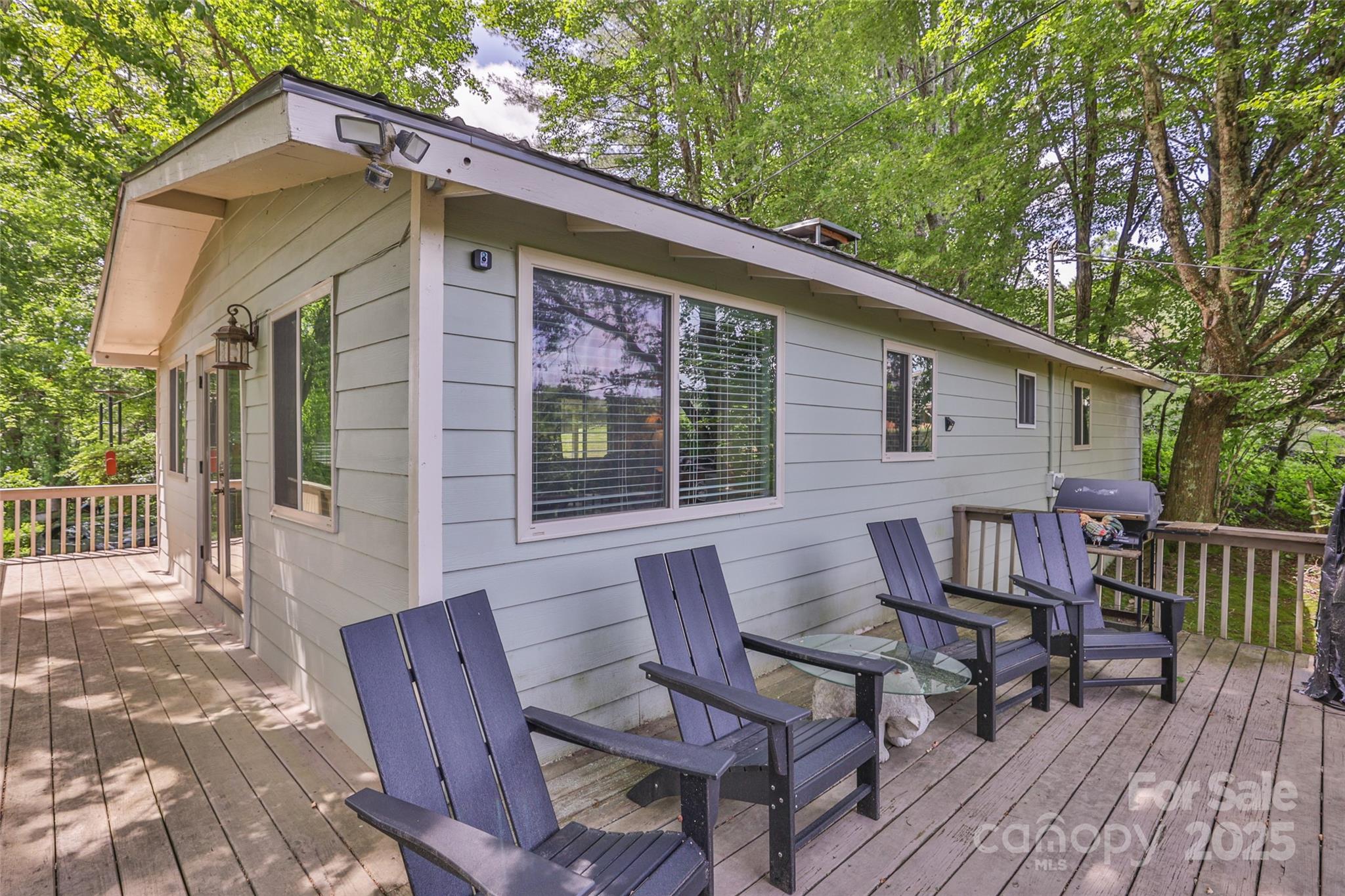 56 Faraway Drive Cullowhee, NC 28723 - Photo 24 of 46 a view of a house with a patio and a yard