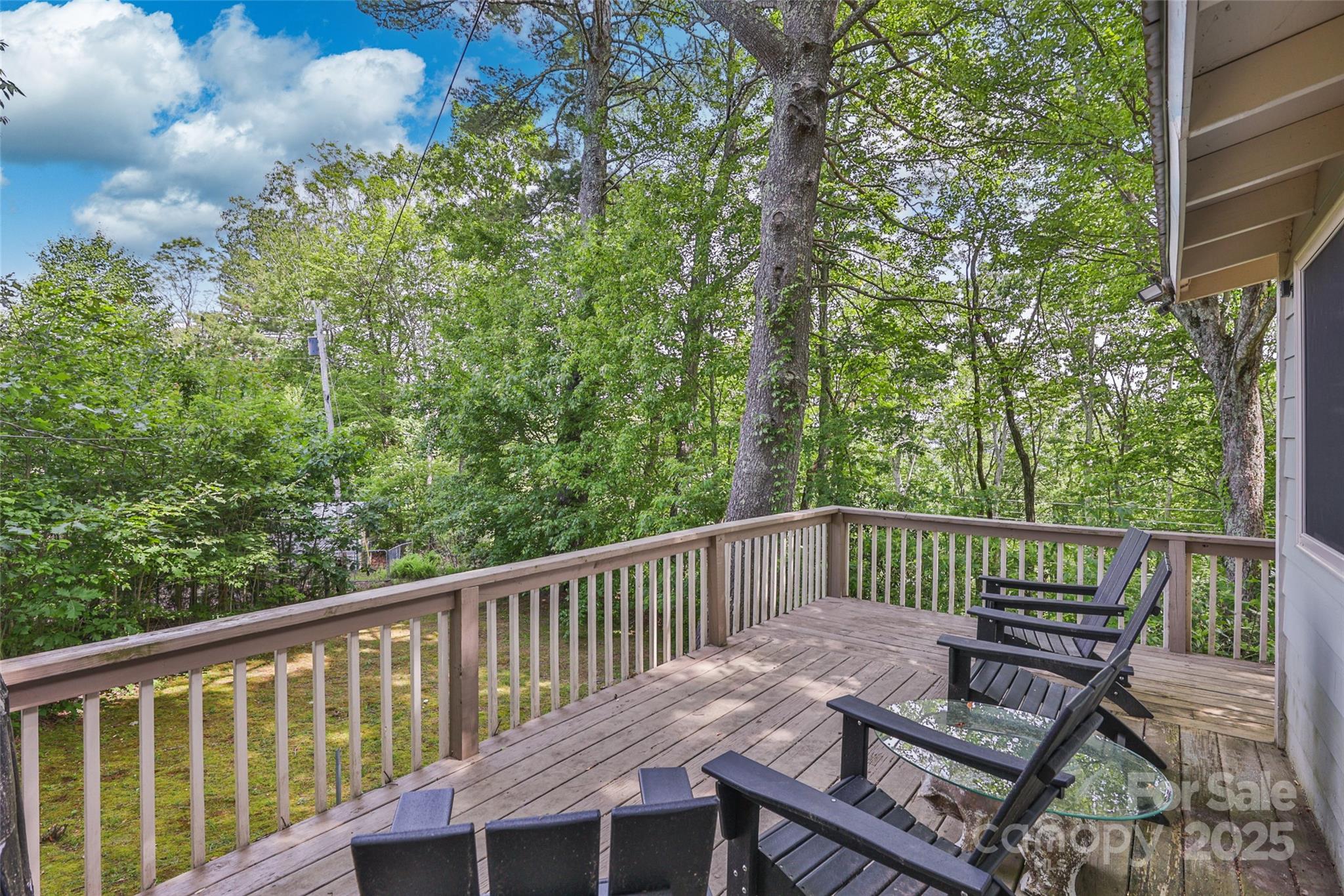 56 Faraway Drive Cullowhee, NC 28723 - Photo 28 of 46 a view of a deck with two chairs and wooden fence