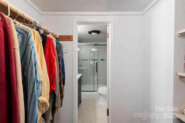 a bathroom with a sink vanity granite shower and a mirror