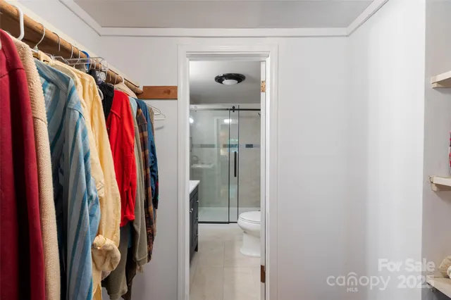 a bathroom with a sink vanity granite shower and a mirror