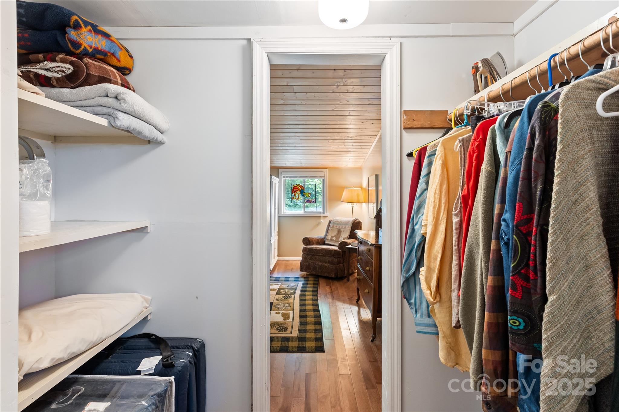 56 Faraway Drive Cullowhee, NC 28723 - Photo 35 of 46 a view of walk in closet with clothes and shoes