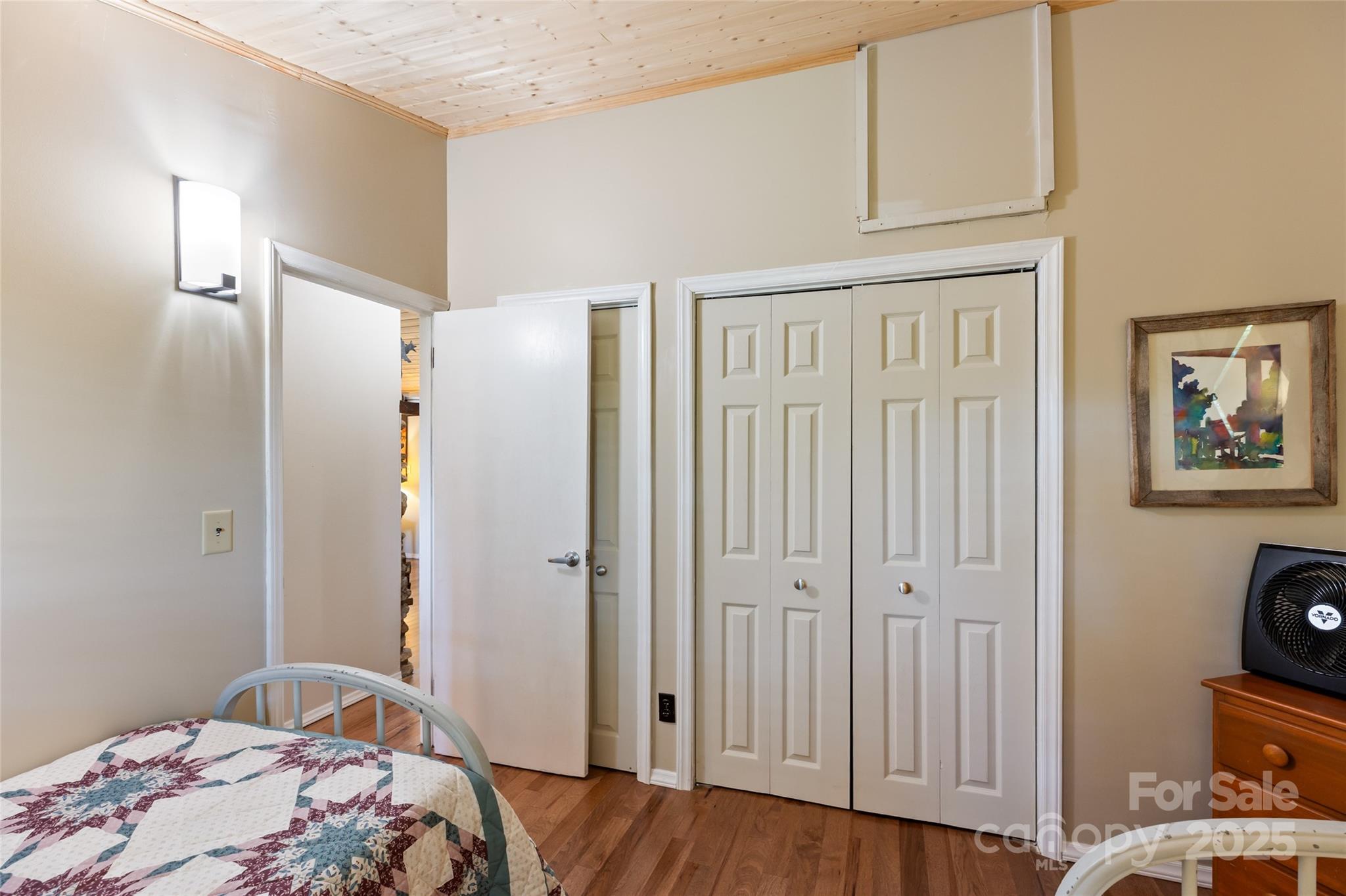 56 Faraway Drive Cullowhee, NC 28723 - Photo 37 of 46 a bedroom with a bed and a mirror